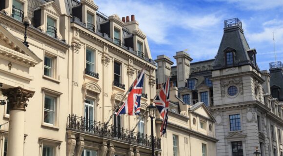 Street view image of the exterior of a Hotel located in London flying the Union Jack flag