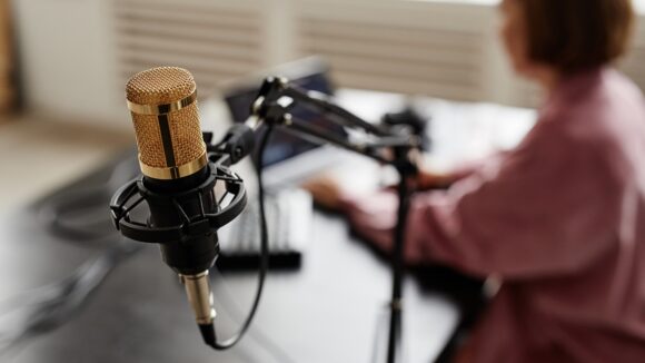 podcast set-up with woman in studio