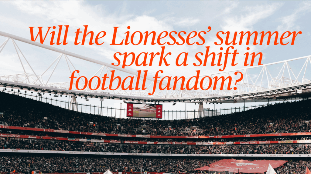 image depicts a football stadium with womens football fans awaiting a game.