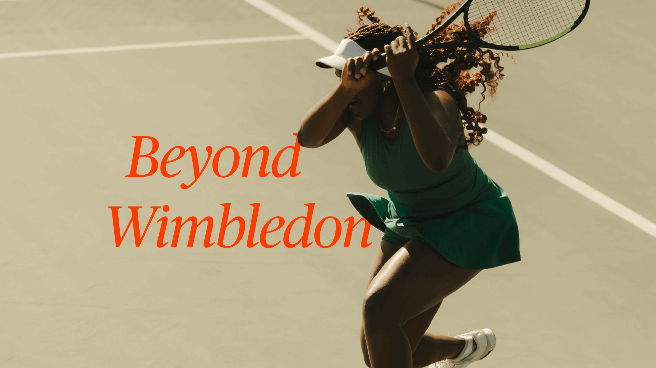 Female tennis player wearing sun visor holding the racket in motion after returning a volley on a court