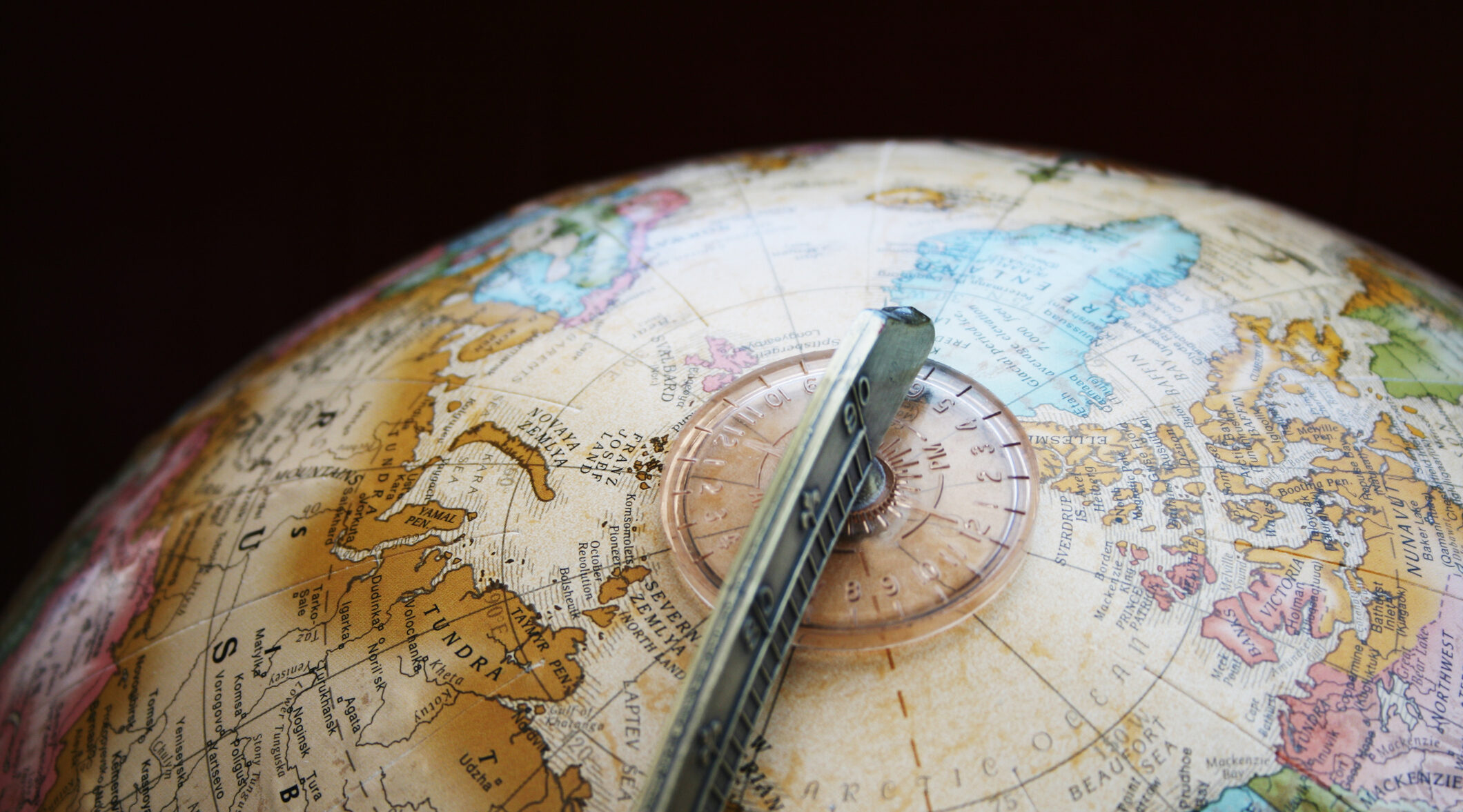 Top of a globe in a dark room.