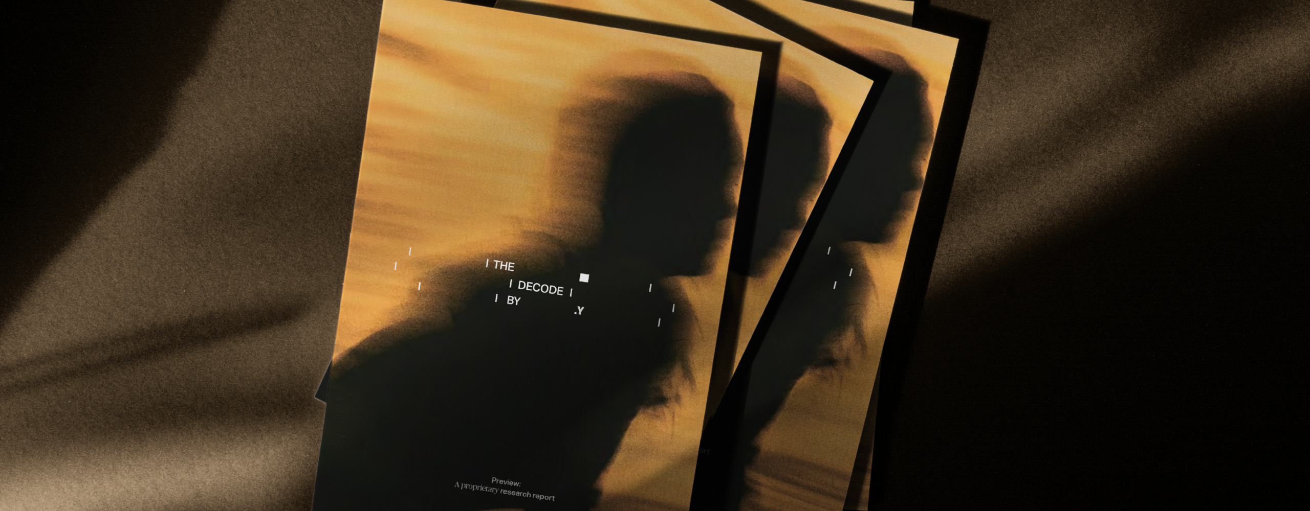 Copies of The Decode report stacked on top of one another against a dark background.